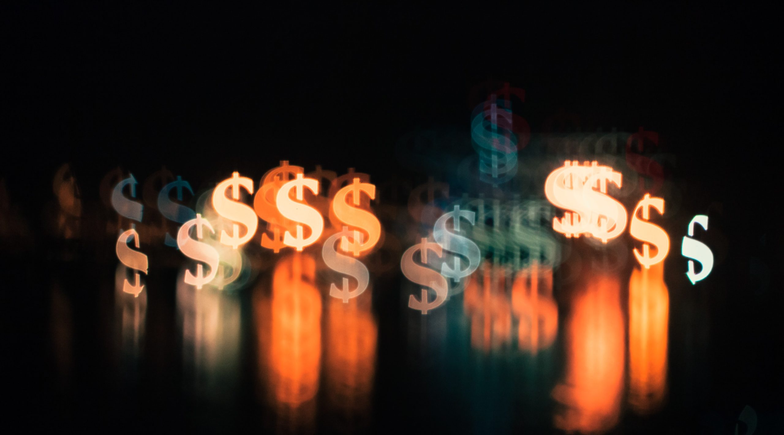 A dark background with multiple blurred dollar sign symbols in various colors, including orange, white, and blue, creating a glowing, reflective effect.